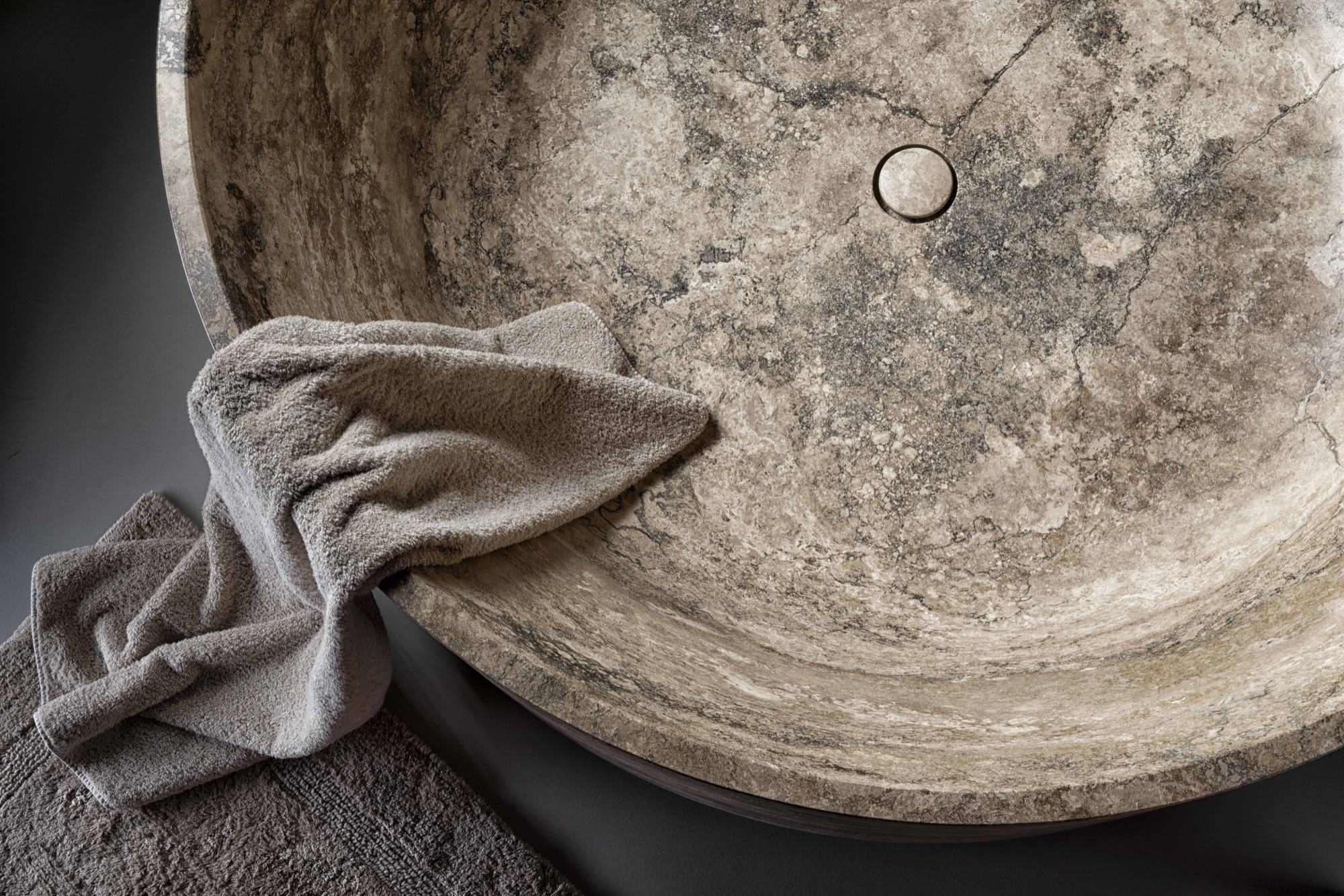 Vaselli — carved stone basin detail